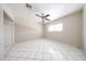 Bright, spacious bedroom featuring ample natural light, ceiling fan and tile flooring at 3513 W Maryland Ave, Phoenix, AZ 85019