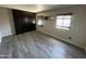 Bedroom featuring wood flooring, a large closet, and natural light from the windows at 3513 W Maryland Ave, Phoenix, AZ 85019