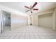Spacious bedroom featuring tile flooring, a closet and ensuite bathroom with walk-in shower at 3513 W Maryland Ave, Phoenix, AZ 85019