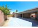 Exterior carport with concrete floor and fenced yard for ample parking and privacy at 3513 W Maryland Ave, Phoenix, AZ 85019