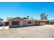 Single-story home with low maintenance desert front yard and covered carport, ready for your personal touches at 3513 W Maryland Ave, Phoenix, AZ 85019