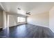 Large, bright living room featuring vinyl flooring and a ceiling fan at 3513 W Maryland Ave, Phoenix, AZ 85019