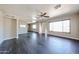 Spacious living room featuring ample natural light, vinyl flooring and a ceiling fan at 3513 W Maryland Ave, Phoenix, AZ 85019
