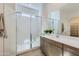 Modern bathroom featuring a glass-enclosed shower, quartz countertop, and sleek fixtures at 3752 E Terrel St, San Tan Valley, AZ 85143