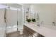 Contemporary bathroom with a glass shower, white quartz countertop, and stylish fixtures at 3752 E Terrel St, San Tan Valley, AZ 85143