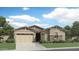 Charming single-Gathering home featuring a two-car garage and stone veneer details at 3752 E Terrel St, San Tan Valley, AZ 85143