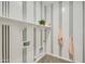Bright laundry room with shelving and neutral striped decor at 3752 E Terrel St, San Tan Valley, AZ 85143