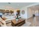 Open-concept living room showcasing stylish furniture and seamless integration with the kitchen at 3752 E Terrel St, San Tan Valley, AZ 85143