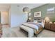 Inviting primary bedroom featuring a comfortable bed, stylish lighting, and neutral decor at 3752 E Terrel St, San Tan Valley, AZ 85143