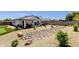 Expansive backyard featuring desert landscaping, outdoor kitchen, patio, and putting green at 3806 N 23Rd Ave, Phoenix, AZ 85015