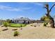 Expansive backyard with a putting green and desert landscaping at 3806 N 23Rd Ave, Phoenix, AZ 85015