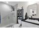 Bathroom featuring a glass-enclosed shower and sleek vanity with modern fixtures at 3806 N 23Rd Ave, Phoenix, AZ 85015