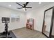 Bedroom featuring a vanity table, exercise equipment and ceiling fan at 3806 N 23Rd Ave, Phoenix, AZ 85015