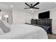 Large bedroom with a ceiling fan, and a dresser with a TV at 3806 N 23Rd Ave, Phoenix, AZ 85015