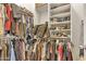 Spacious walk-in closet with ample storage, shelves, and hanging space for clothes and shoes at 40061 W Novak Ln, Maricopa, AZ 85138