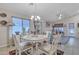 Dining room next to kitchen filled with natural light and a chandelier, perfect for gatherings at 40061 W Novak Ln, Maricopa, AZ 85138