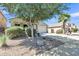 Charming single-story home with a well-maintained yard, desert landscaping, and a spacious driveway at 40061 W Novak Ln, Maricopa, AZ 85138