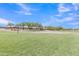 Large community green space bordered by walking path at 40061 W Novak Ln, Maricopa, AZ 85138