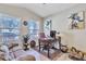 Comfortable home office with neutral walls, wood-look floors, and a bright window at 40061 W Novak Ln, Maricopa, AZ 85138