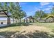 Community picnic area with covered tables, green space and mature trees at 40061 W Novak Ln, Maricopa, AZ 85138