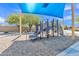 Community playground with climbing structure, slides and shade at 40061 W Novak Ln, Maricopa, AZ 85138