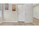Neutral room with white doors, baseboards, carpet floors and decorative artwork on the walls at 40061 W Novak Ln, Maricopa, AZ 85138