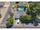 Overhead view of home with solar panels, inviting pool, set within a lush, green neighborhood at 405 E Stanford Ave, Gilbert, AZ 85234