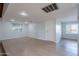 A finished basement with two windows, a door and light wood colored flooring throughout at 405 E Stanford Ave, Gilbert, AZ 85234