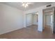 Bedroom with mirrored closet doors, light colored flooring, a ceiling fan and light colored walls at 405 E Stanford Ave, Gilbert, AZ 85234
