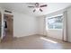 Large bedroom featuring light wood floors and natural light at 405 E Stanford Ave, Gilbert, AZ 85234