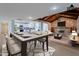 Open dining room with views of the kitchen and living room stone fireplace at 405 E Stanford Ave, Gilbert, AZ 85234