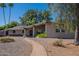 Charming single-story brick home with well-maintained landscaping and inviting walkway at 405 E Stanford Ave, Gilbert, AZ 85234