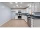 Kitchen with white cabinets, stainless steel appliances and light colored flooring at 405 E Stanford Ave, Gilbert, AZ 85234