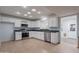 Bright kitchen with white cabinets, stainless steel appliances and light colored flooring at 405 E Stanford Ave, Gilbert, AZ 85234