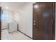 Laundry room with white appliances and wire shelving above the machines at 405 E Stanford Ave, Gilbert, AZ 85234