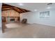 Living room featuring stone fireplace, vaulted ceilings, and hardwood floors at 405 E Stanford Ave, Gilbert, AZ 85234
