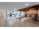 Spacious living area with modern kitchen and stone fireplace, perfect for entertaining at 405 E Stanford Ave, Gilbert, AZ 85234