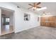 Open concept living room featuring tiled floors, lots of natural light, and backyard access at 405 E Stanford Ave, Gilbert, AZ 85234