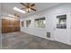 Bright living room with tile flooring, ceiling fans, and access to the backyard at 405 E Stanford Ave, Gilbert, AZ 85234