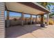 Covered patio area with decorative elements and fire pit at 405 E Stanford Ave, Gilbert, AZ 85234