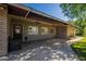 Covered patio with ceiling fans, showcasing a relaxing outdoor living space with access to the backyard at 405 E Stanford Ave, Gilbert, AZ 85234