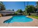 Backyard swimming pool with mature trees and landscaping at 405 E Stanford Ave, Gilbert, AZ 85234