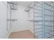 Spacious walk-in closet with ample storage space featuring adjustable shelving and wire basket drawers at 405 E Stanford Ave, Gilbert, AZ 85234