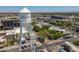 An aerial view highlights Gilbert's water tower surrounded by vibrant commercial and retail spaces at 405 E Stanford Ave, Gilbert, AZ 85234