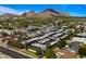 Aerial view of the community with picturesque mountain views in the background at 4411 N 40Th St # 40, Phoenix, AZ 85018