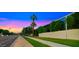 Beautiful exterior view of the community with green grass and lush landscaping at sunset at 4411 N 40Th St # 40, Phoenix, AZ 85018