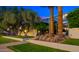 Contemporary home featuring modern architecture, lush landscaping, and eye-catching palm trees for striking curb appeal at 4411 N 40Th St # 40, Phoenix, AZ 85018