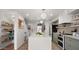 Bright kitchen featuring an eat-in island, designer cabinets, and stainless steel appliances for a modern cooking experience at 4411 N 40Th St # 40, Phoenix, AZ 85018
