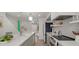 Modern kitchen featuring a quartz island, designer cabinets, and stainless steel appliances for a top-notch culinary experience at 4411 N 40Th St # 40, Phoenix, AZ 85018