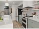 Modern kitchen featuring a quartz island, designer cabinets, and stainless steel appliances for a top-notch culinary experience at 4411 N 40Th St # 40, Phoenix, AZ 85018